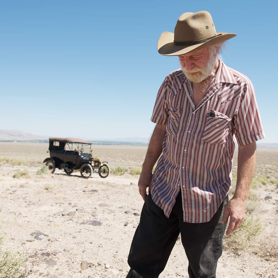 model t and man in desert
